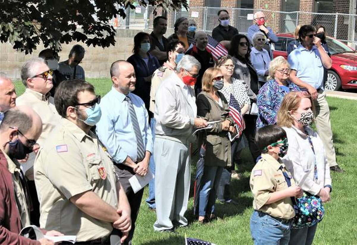 People watch and pray during National Day of Prayer observance at the Granite City Hall Thursday. The nationwide annual observance, which had been heavily curtailed last year because of COVID, was back this year with a variety of in-person and remote events. Local events include two live meetings in Granite City, another in Jerseyville, and a remote event in Alton.
