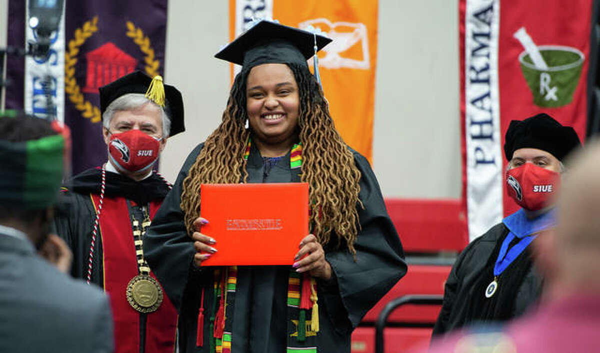 SIUE Chancellor Randy Pembrook, left, greets alumna Tatyana Curtis with Provost and Vice Chancellor for Academic Affairs Denise Cobb in a celebration of 2020 graduates who were unable to celebrate in-person during spring and fall 2020 because of the COVID-19 pandemic. Commencement exercises continue through Sunday.