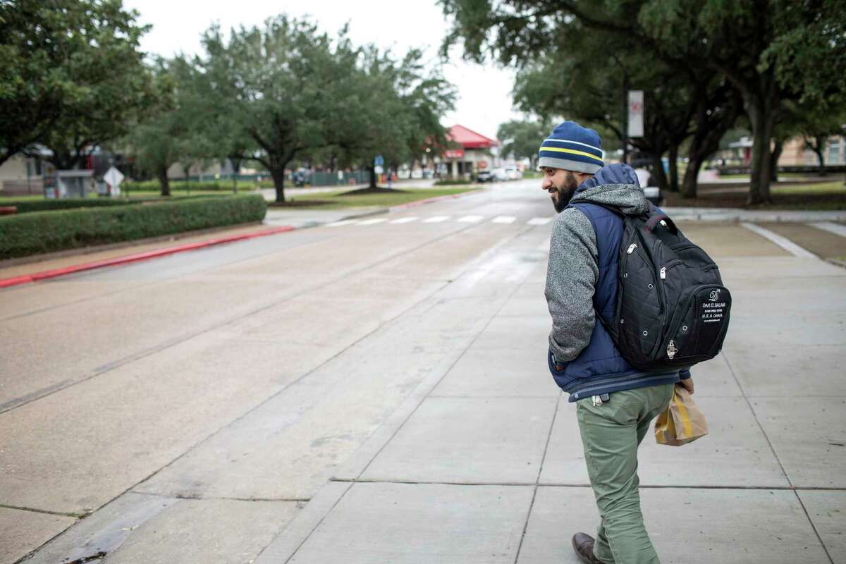 Asher Khan when he was preparing for finals at the University of Houston on Tuesday, Dec. 10, 2019, in Houston. Khan served 18 months in federal prison after he was convicted of providing material support to ISIS. He and a friend traveled to Turkey to join the fight against Syrian dictator Bashar Al-Assad, but Khan backed out. His friend stayed and was killed in the fighting. The Justice Department has twice appealed his 18-month prison sentence saying it was too short. The appeals court said the third sentencing must be handled by another judge.