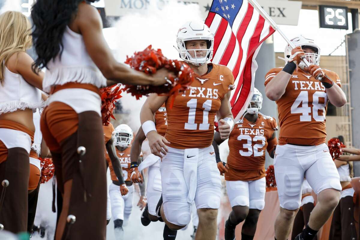 AUSTIN, TX - AUGUST 31: Sam Ehlinger #11 of the Texas Longhorns and Jake Ehlinger #48 run onto the field before the game against the Louisiana Tech Bulldogs at Darrell K Royal-Texas Memorial Stadium on August 31, 2019 in Austin, Texas.
