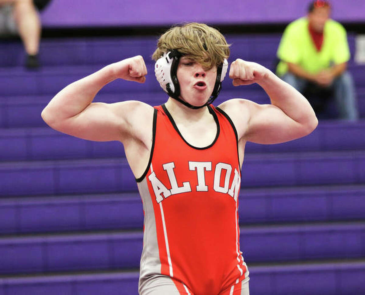 Alton’s Caleb Chistner celebrates his victory at 152 pounds against Roxana in a wrestling triangular meet in Bethalto.