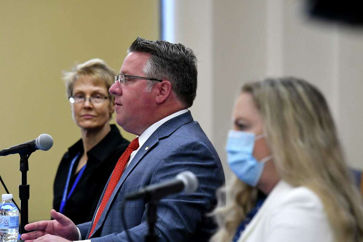 Albany County Executive Dan McCoy, center, is joined by Karen Ziegler, Director of the Albany County Crime Victim and Sexual Violence Center, left, and County Department of Health Commissioner Dr. Elizabeth Whalen, right, for a coronavirus news briefing on Friday, May 7, 2021, at the county offices in Albany, N.Y. (Will Waldron/Times Union)