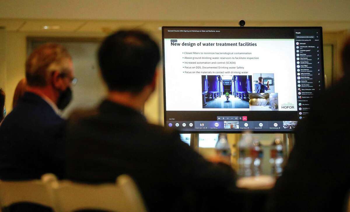 Participants listen to a discussion during a virtual and in-person workshop on none revenue water and the Danish path to 5 percent NRW, in the Legacy Room in City Hall, Monday, May 3, 2021, in Houston, as the city of Copenhagen and the city of Houston are joining together to tackle climate change.
