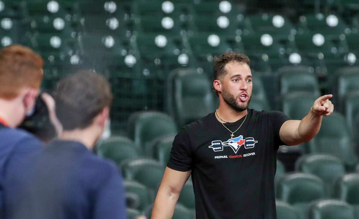 George Springer, on the injured list for Toronto's lone regular-season visit to Minute Maid Park, mingled with former Astros teammates before Friday's series opener.