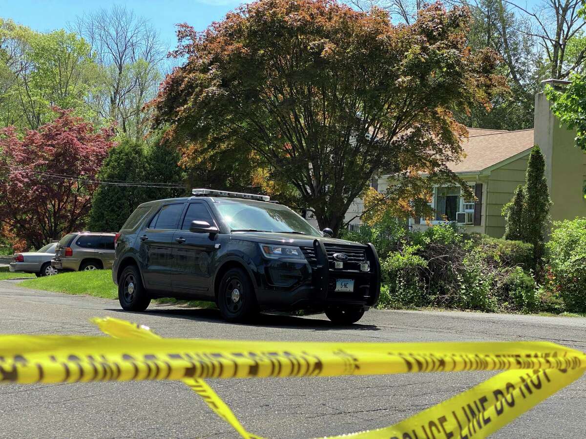 The home of Albert Kokoth on Down River Road in New Canaan, where a police car can be seen and caution tape is draped across the road. Albert Kokoth has been charged with murder in connection to his wife Margaret's death.