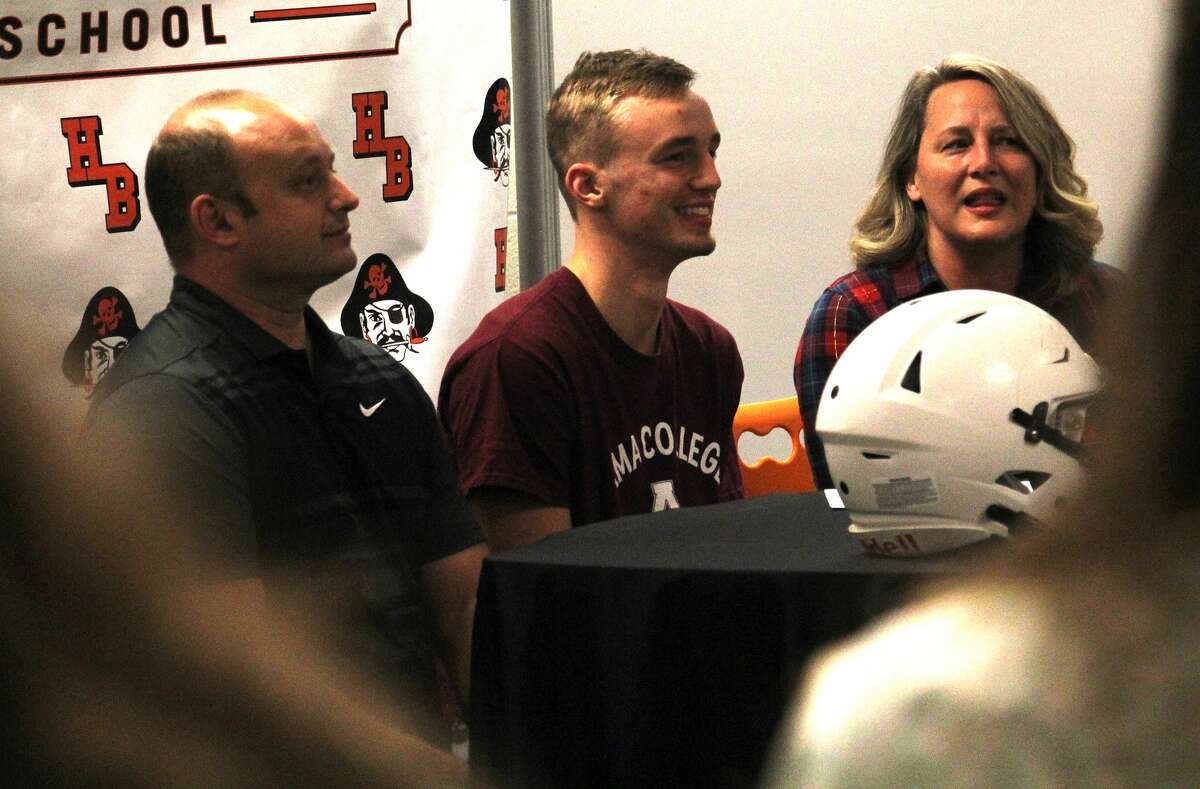 Harbor Beach senior Dylan Kadar, front row, center, signed a letter of intent on Friday morning to attend and play football at Alma College.