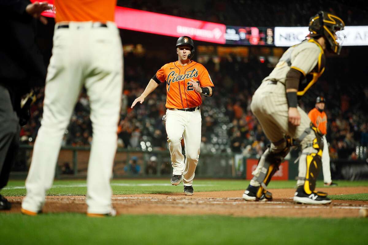 Giants catcher Buster Posey makes it to home on Evan Longoria’s single Friday night.