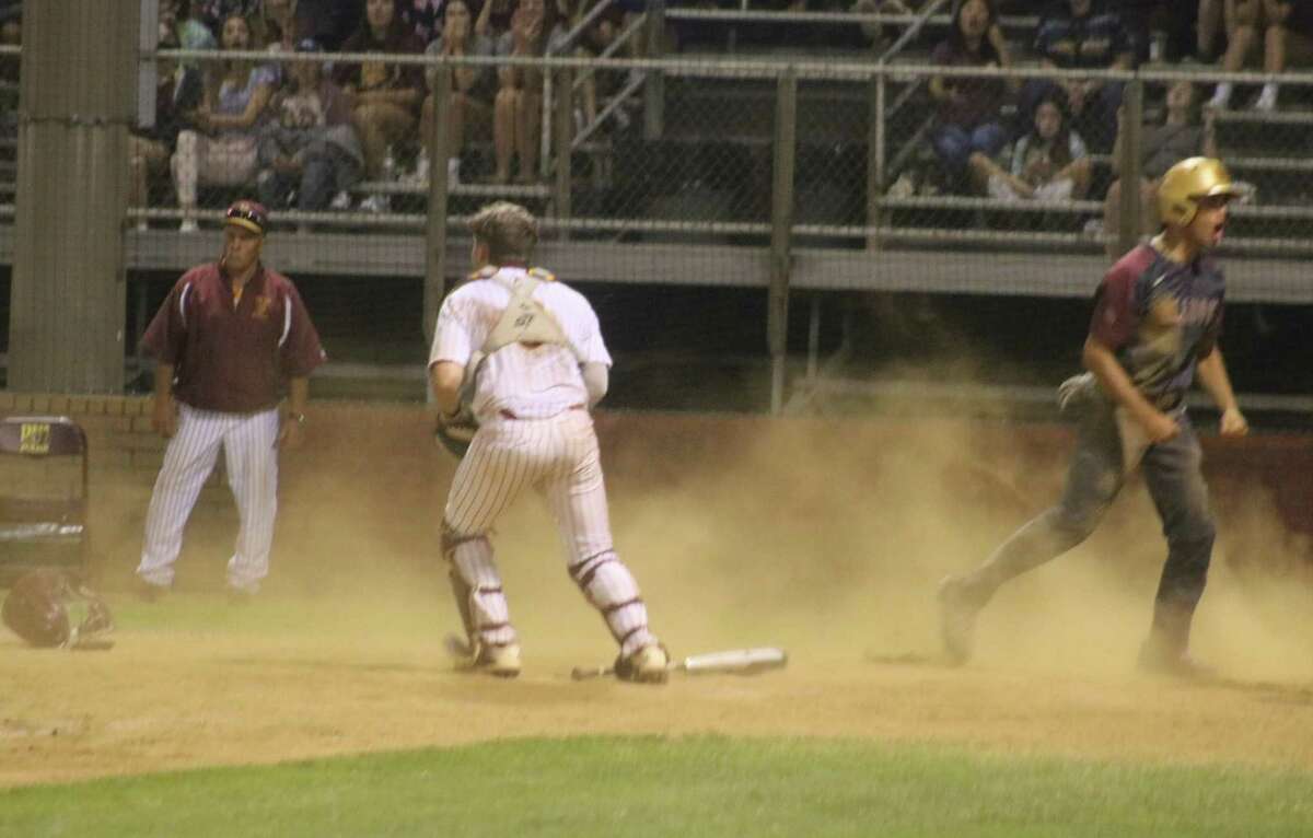 Deer Park catcher Tanner Phillips came up empty on this tag attempt at the plate during Summer Creek's seventh inning Friday night. A ground ball to second base led to the late throw to home as the Bulldog lead climbed to 5-2.
