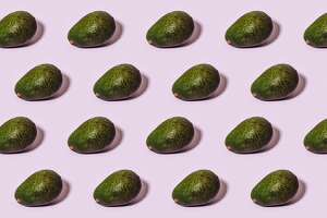 Avocado pattern over pink background.