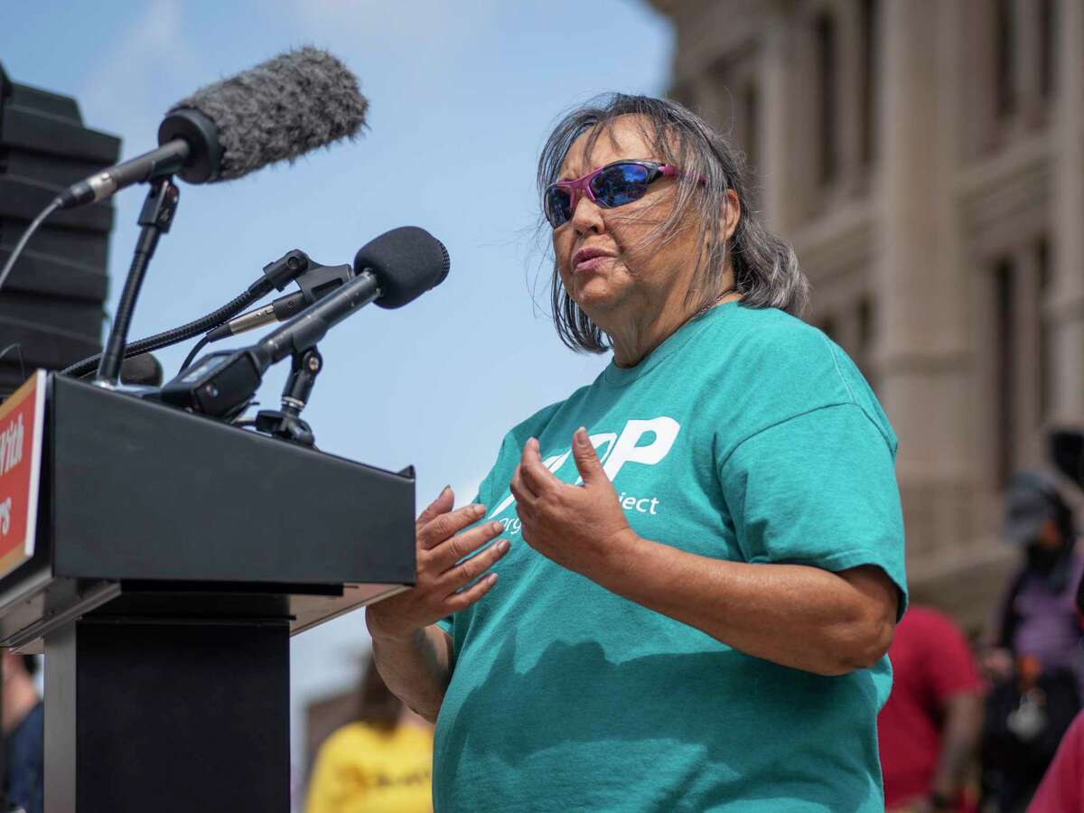 FILE PHOTO — Rosie Castro, civil rights and political activist from San Antonio, speaks from the podium during a voting rights rally at the Texas State Capitol in Austin, Tx., U.S. on Saturday, May 8, 2021. The rally was held in response to a number of bills making their way through the Texas Legislature that critics say would restrict voting access for Texans across the state by shutting down polling places and creating barriers to voting for historically marginalized communities.