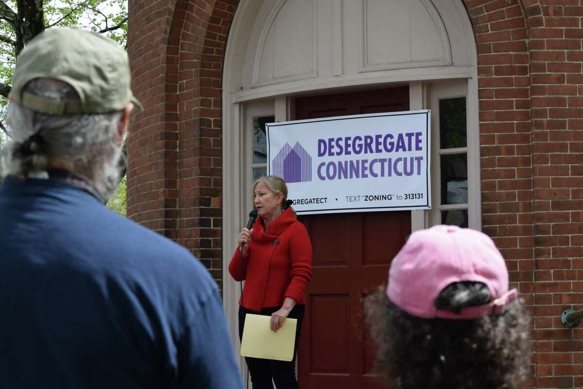 About 100 people attended the rally in Deep River, Conn. Saturday, May 8, 2021 advocating for affordable housing.
