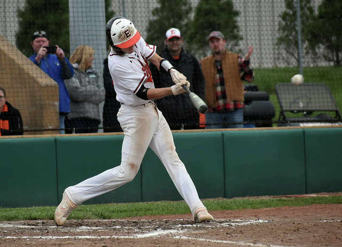 Edwardsville’s Grant Huebner connects for an RBI single in the sixth inning against Collinsville on Saturday at Tom Pile Field.