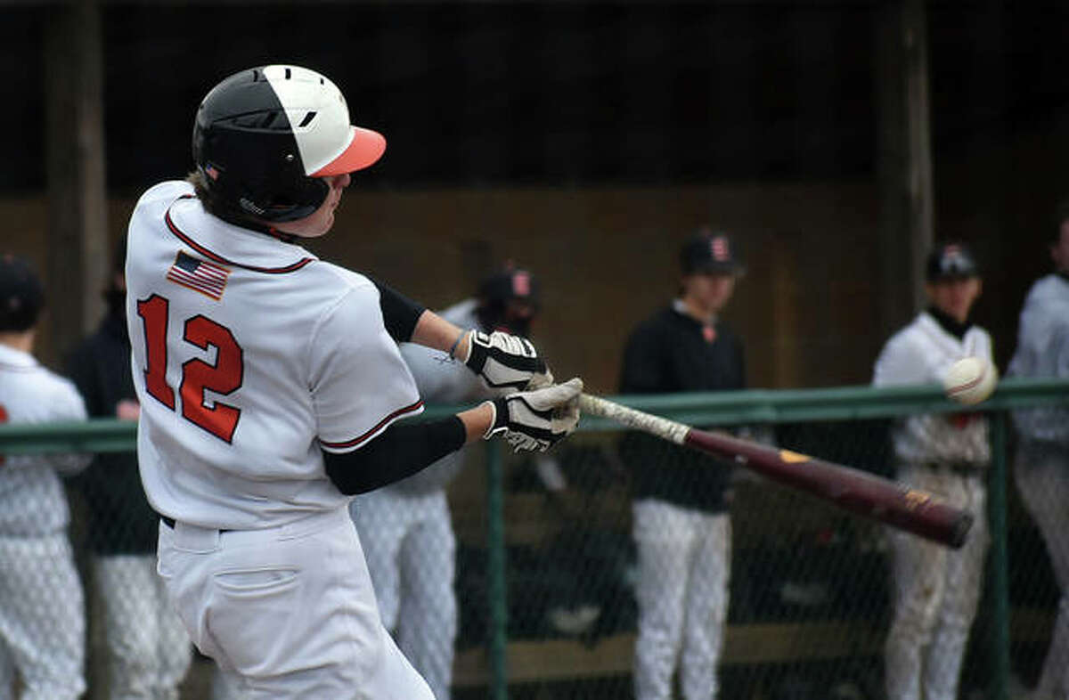 Edwardsville’s Zak Zoelzer hits a line drive in the fifth inning against Collinsville on Saturday at Tom Pile Field.