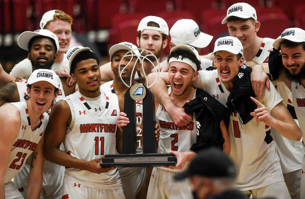 Hartford players celebrate after beating UMass-Lowell in the America East Tournament final March 13.