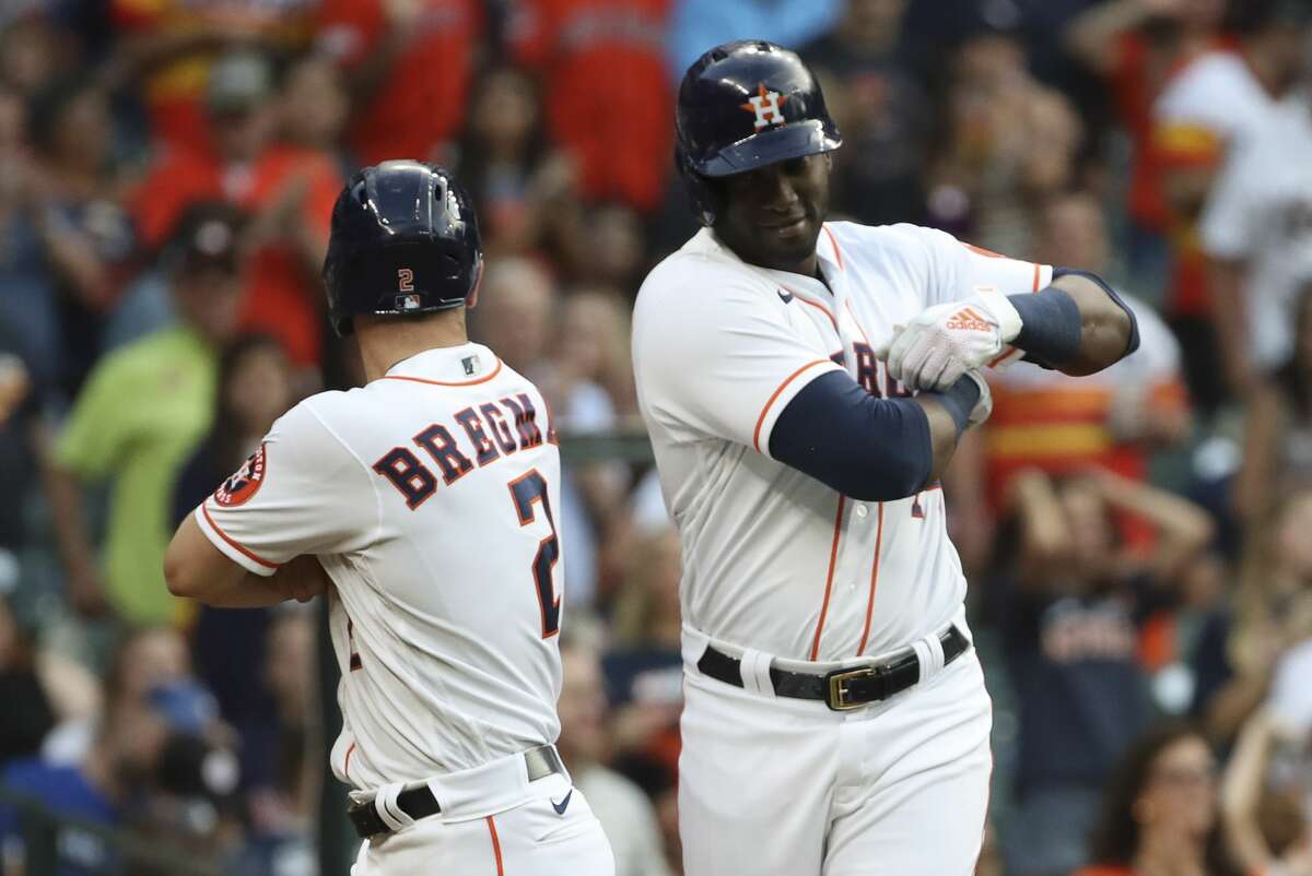 Houston Astros designated hitter Yordan Alvarez (44) celebrates with third baseman Alex Bregman (2) after he hit a home run during the fourth inning of an MLB game Saturday, May 8, 2021, at Minute Maid Park in Houston.