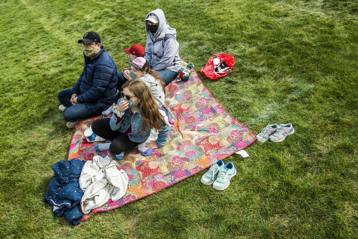 The Garcia family watches as the Great Lakes Loons face off against the Dayton Dragons Sunday, May 9, 2021 at Dow Diamond in Midland. (Isaac Ritchey/for the Daily News)