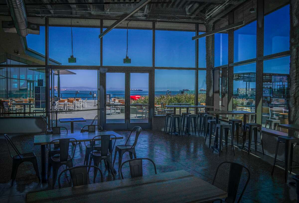 Harmonic Brewing’s new Thrive City taproom near the Chase Center features floor-to-ceiling windows overlooking the bay in San Francisco.