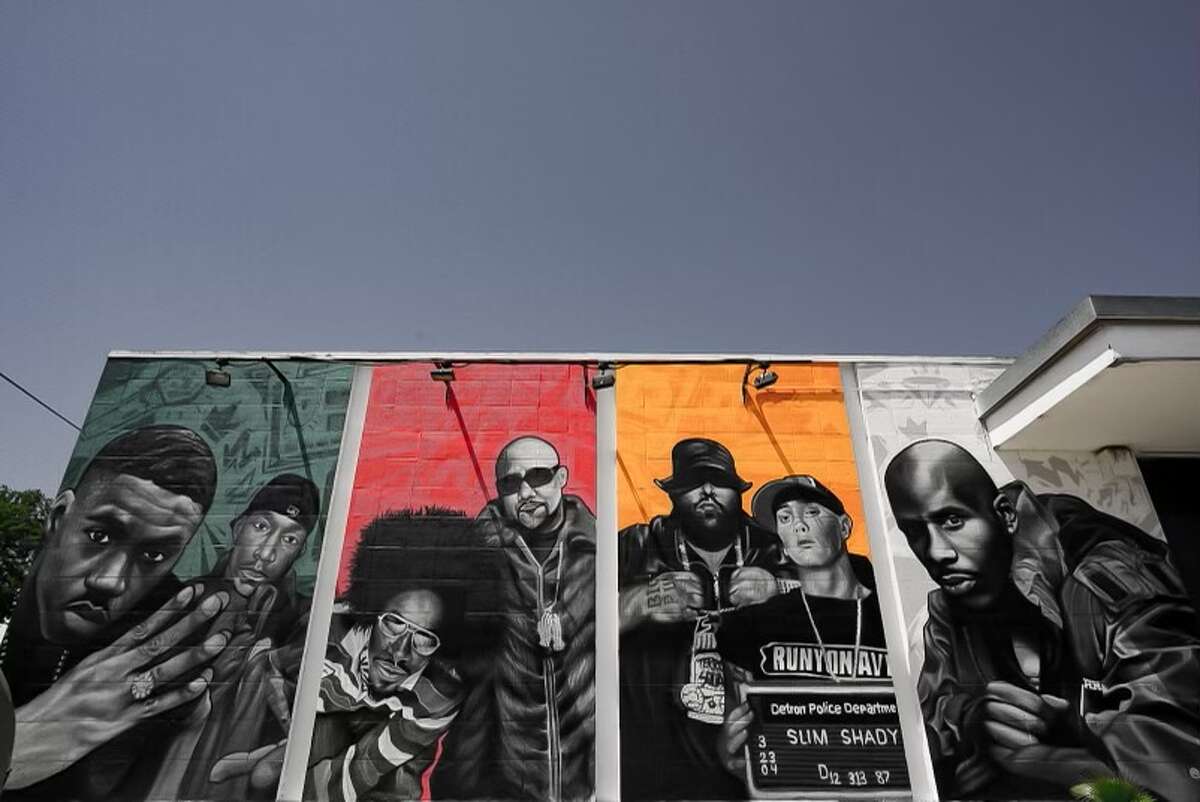 Smack's Chicken Shack owner Keenan Hendricks tapped local muralist Mike Comp to complete a mural at the restaurant honoring rap legends. 