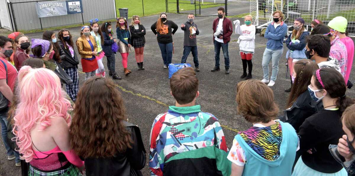 Matthew Farina, center, director and choreographer of the Immaculate High School video production of