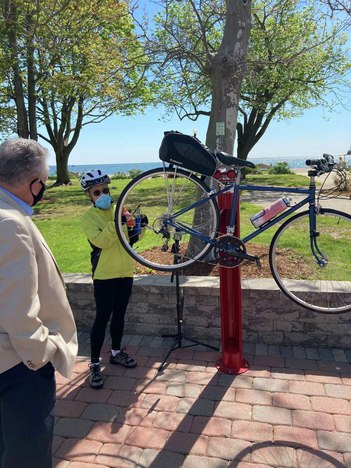 Demonstration on how to use the free bike repair station at Calf Pasture Beach on Friday, May 7.