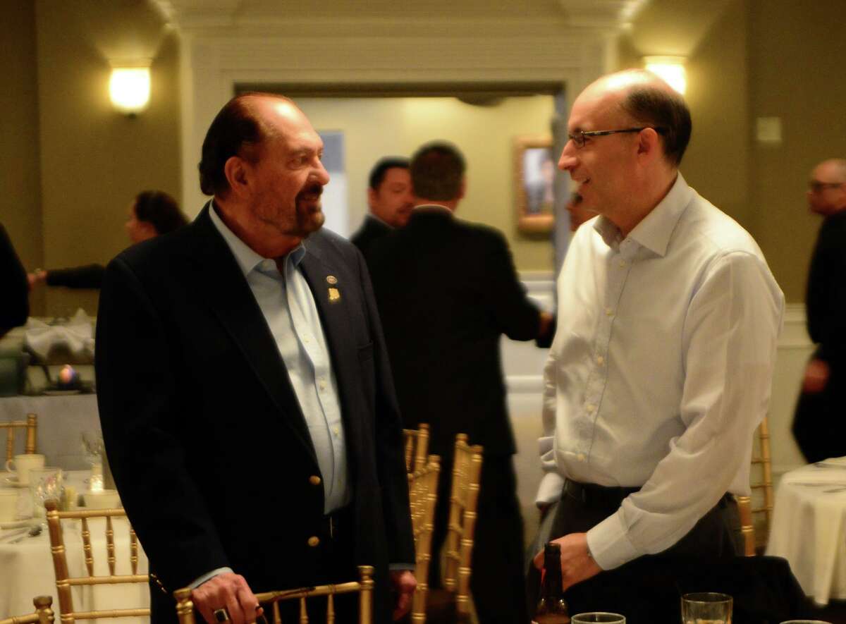 Larry LaConte, left, speaks with Ben Fronsaglia of Shelton at a 2014 fundraiser for Shelton Mayor Mark Lauretti's gubernatorial campaign.