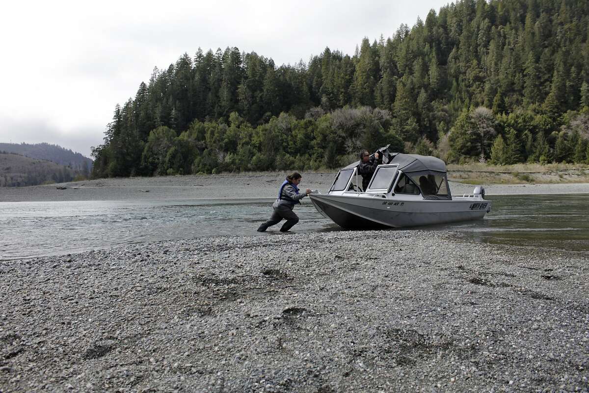 Yurok fish technician Hunter Maltz pushes a jet boat into the low water of the Klamath River in Humboldt County in 2020. Gov. Gavin Newsom has declared a drought emergency for an additional 39 California counties, bringing the number to 41 of California’s 58 counties under drought declaration.