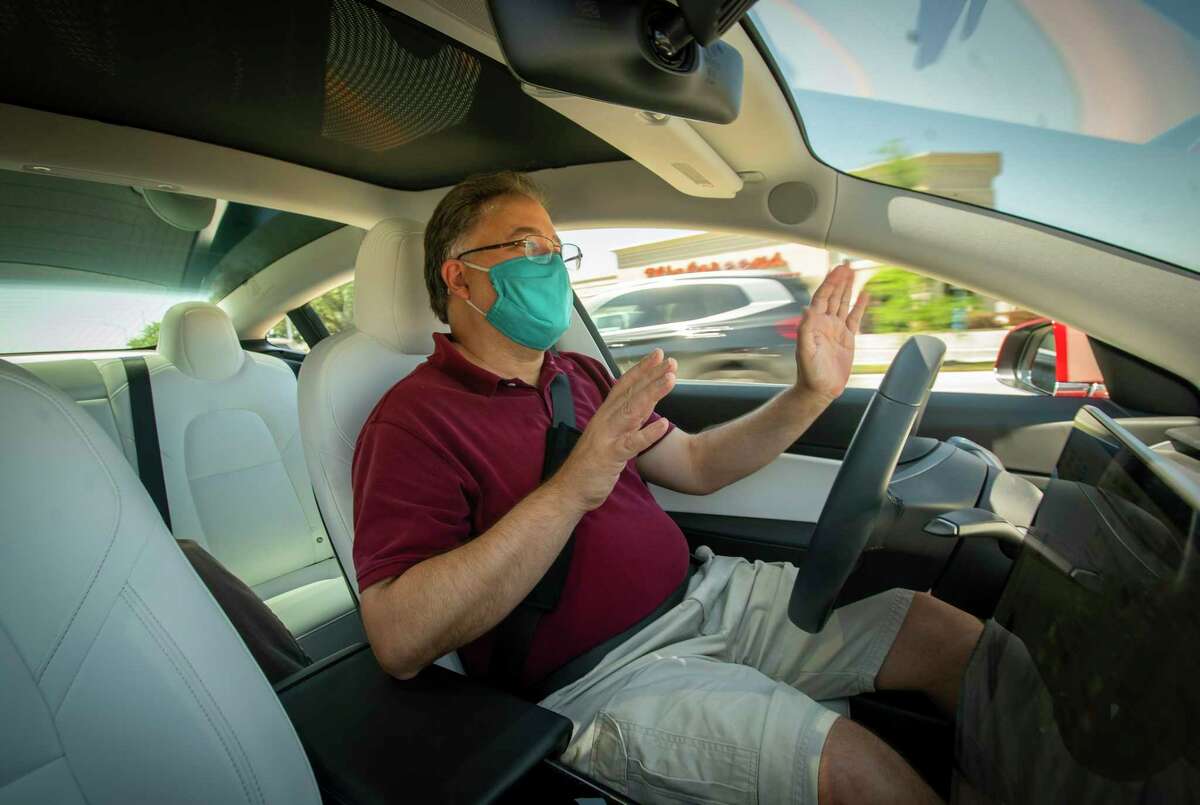 Stephen Pace, founder of the Tesla Owners Group of Houston, demonstrates the capabilities and limitations of the autopilot function in a Tesla Model 3 on Saturday, April 24, 2021, in Houston.
