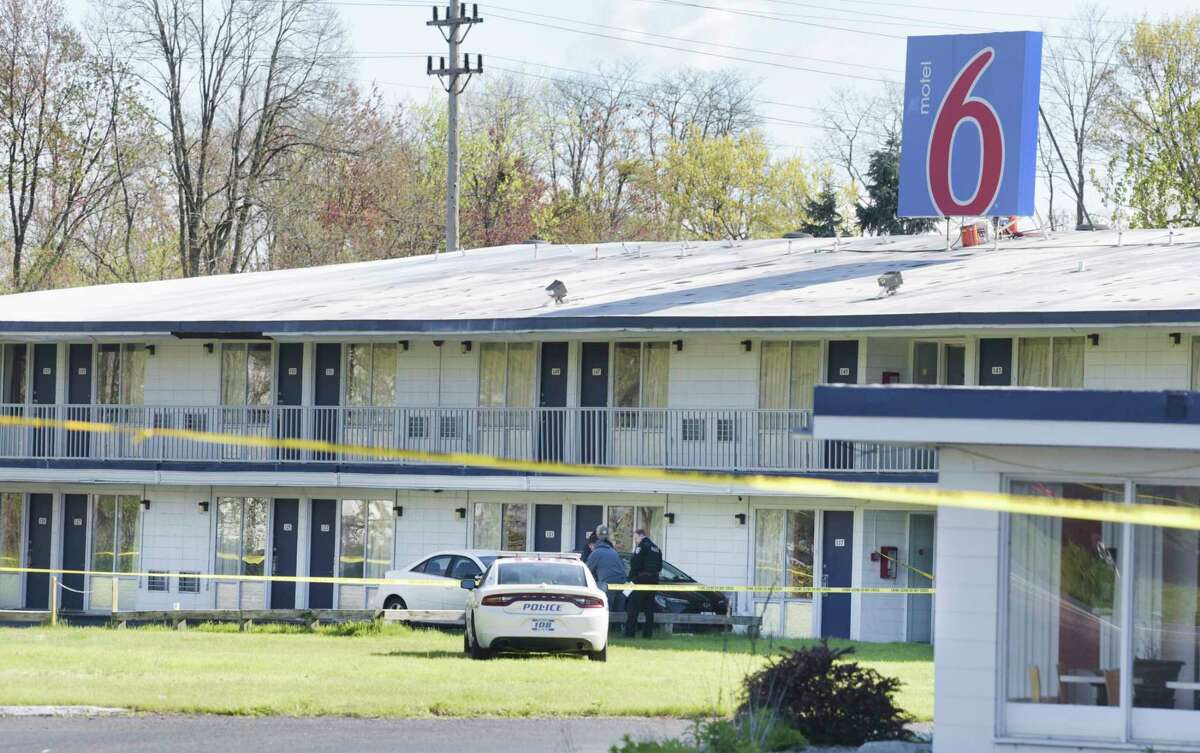 Police investigate at the scene of a Motel 6 on Tuesday, May 11, 2021, in Colonie after Xiaa Price was shot to death. A Schenectady man has been charged with murder in the case. (Paul Buckowski/Times Union)