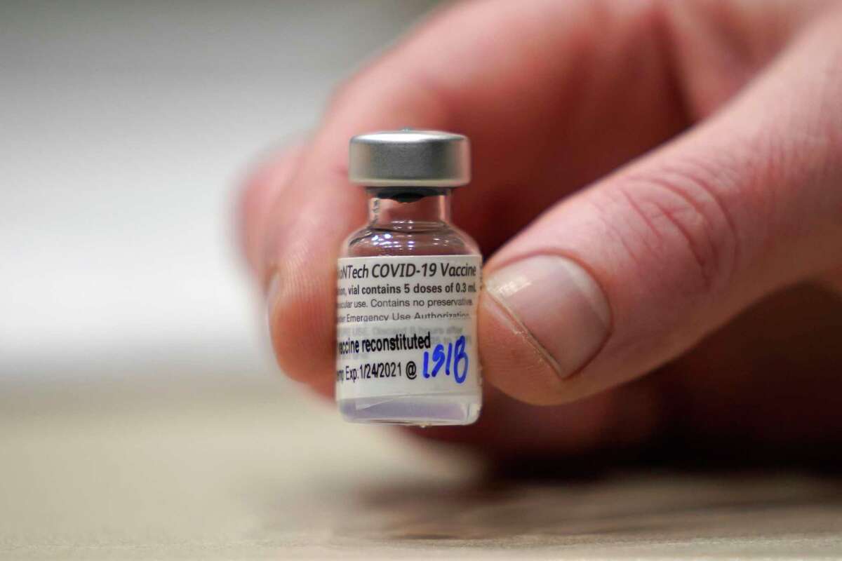 This Jan. 24, 2021, file photo shows a vial of the Pfizer vaccine for COVID-19 in Seattle. U.S. regulators on Monday, May 10, 2021, expanded use of Pfizer's shot to those as young as 12, sparking a race to protect middle and high school students before they head back to class in the fall. (AP Photo/Ted S. Warren, File)