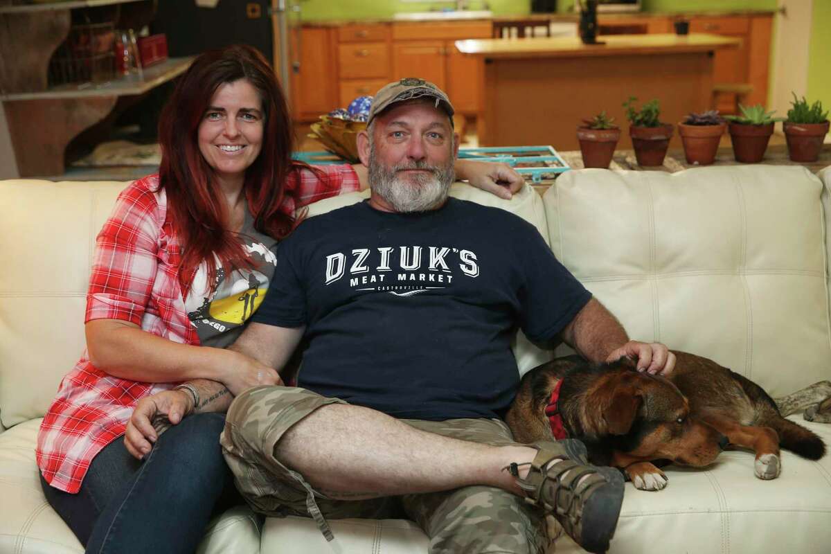 Susan and Mark Logrbrinck, with one of their four dogs, 