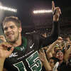 FILE - In this Nov. 23, 2007, file photo, then-Hawaii quarterback Colt Brennan celebrates after an NCAA college football game in Honolulu. Brennan, a star quarterback at the University of Hawaii who finished third in the 2007 Heisman Trophy balloting, died early Tuesday, May 11, 2021, his father said. He was 37. Brennan, who has had public struggles with alcohol, died at a hospital in California, his father, Terry Brennan, told The Associated Press. (AP Photo/Ronen Zilberman, File)