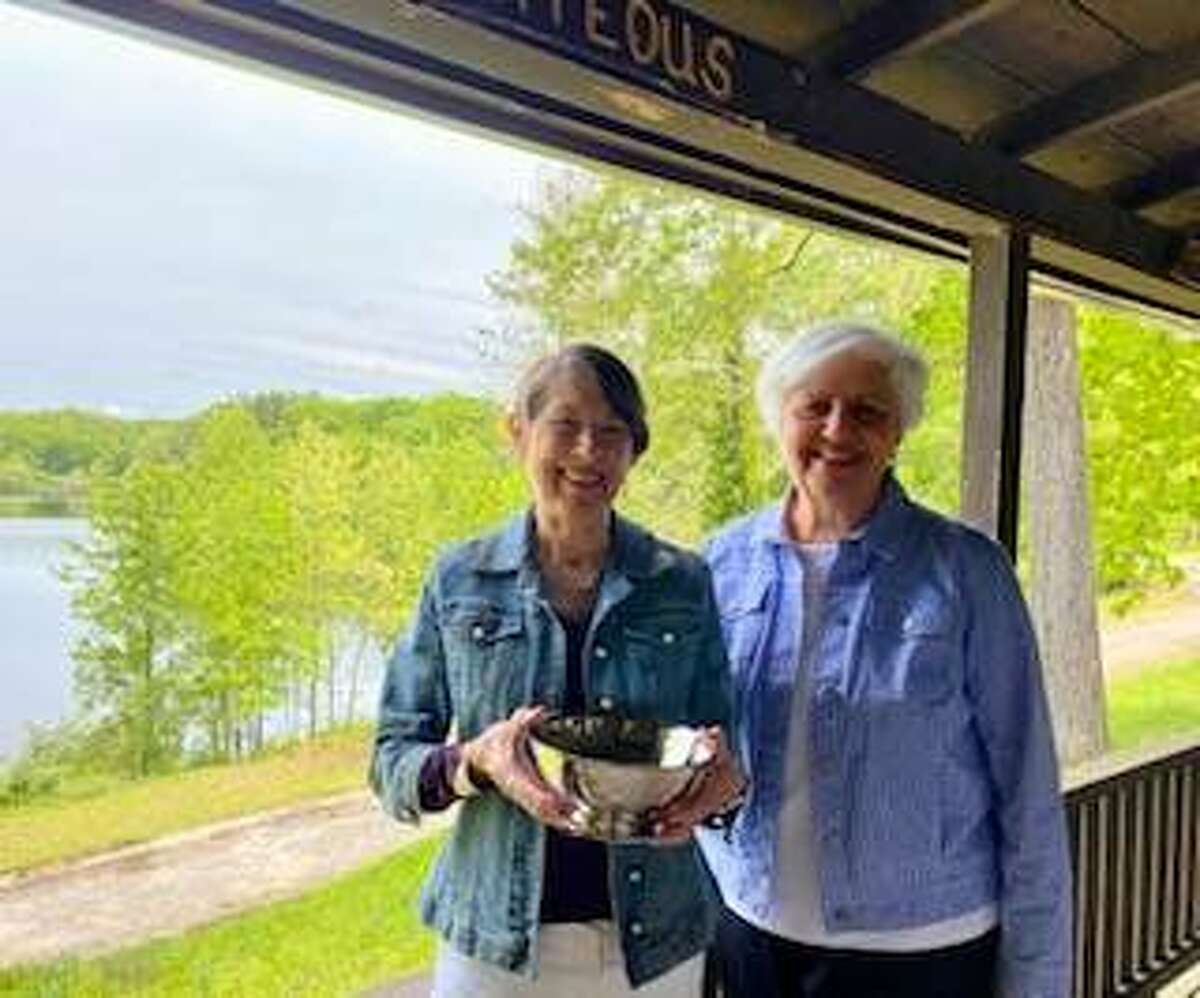 Pictured is Suzanne Lagomarcino, 2020-2021 Silver Bowl Recipient, accepting the Silver Bowl from Janet Hansen, Placement Chairman of Alton Community Service League.