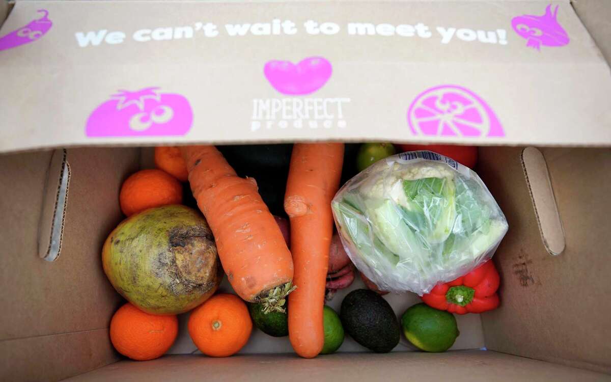 A donation by Imperfect Produce waits to by loaded by volunteers of Second Servings.