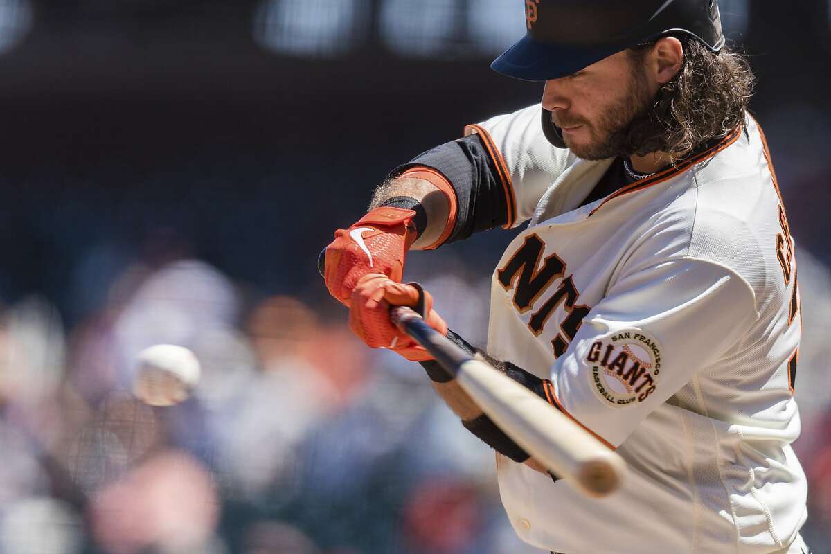 San Francisco Giants’ Brandon Crawford connects for a single against the Texas Rangers during the sixth inning of a game at Oracle Park on May 11.