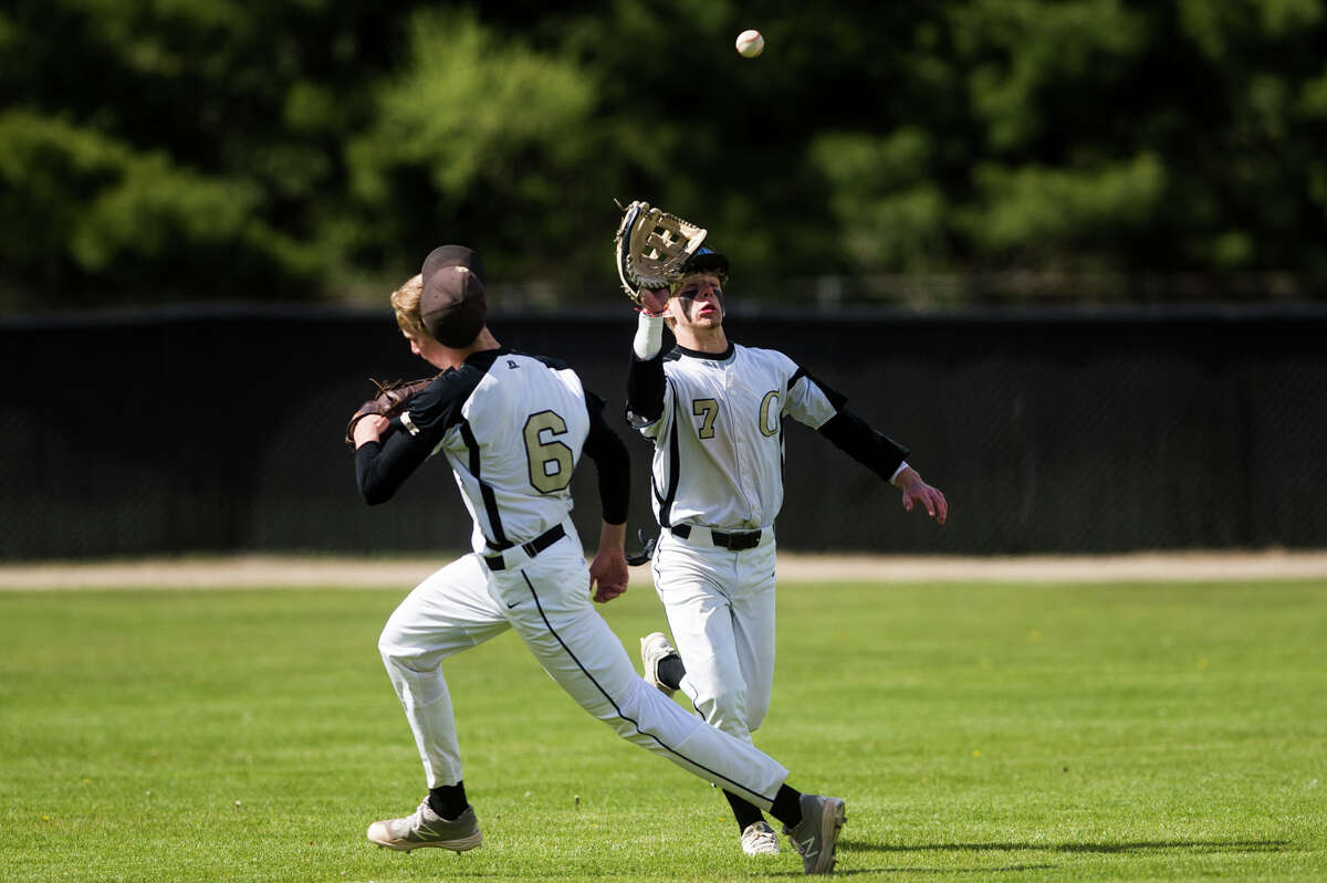 Bullock Creek's Gage Chapin catches a fly ball during a game against Hemlock Tuesday, May 11, 2021 at Bullock Creek High School. (Katy Kildee/kkildee@mdn.net)