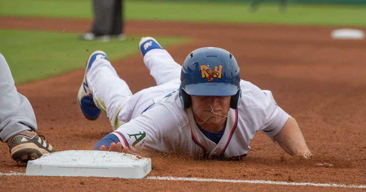 Midland RockHounds' Nick Allen dives back to first on a pickoff attempt as San Antonio Missions' Taylor Kohlwey waits on the ball 05/11/2021 at Momentum Bank Ballpark. Tim Fischer/Reporter-Telegram