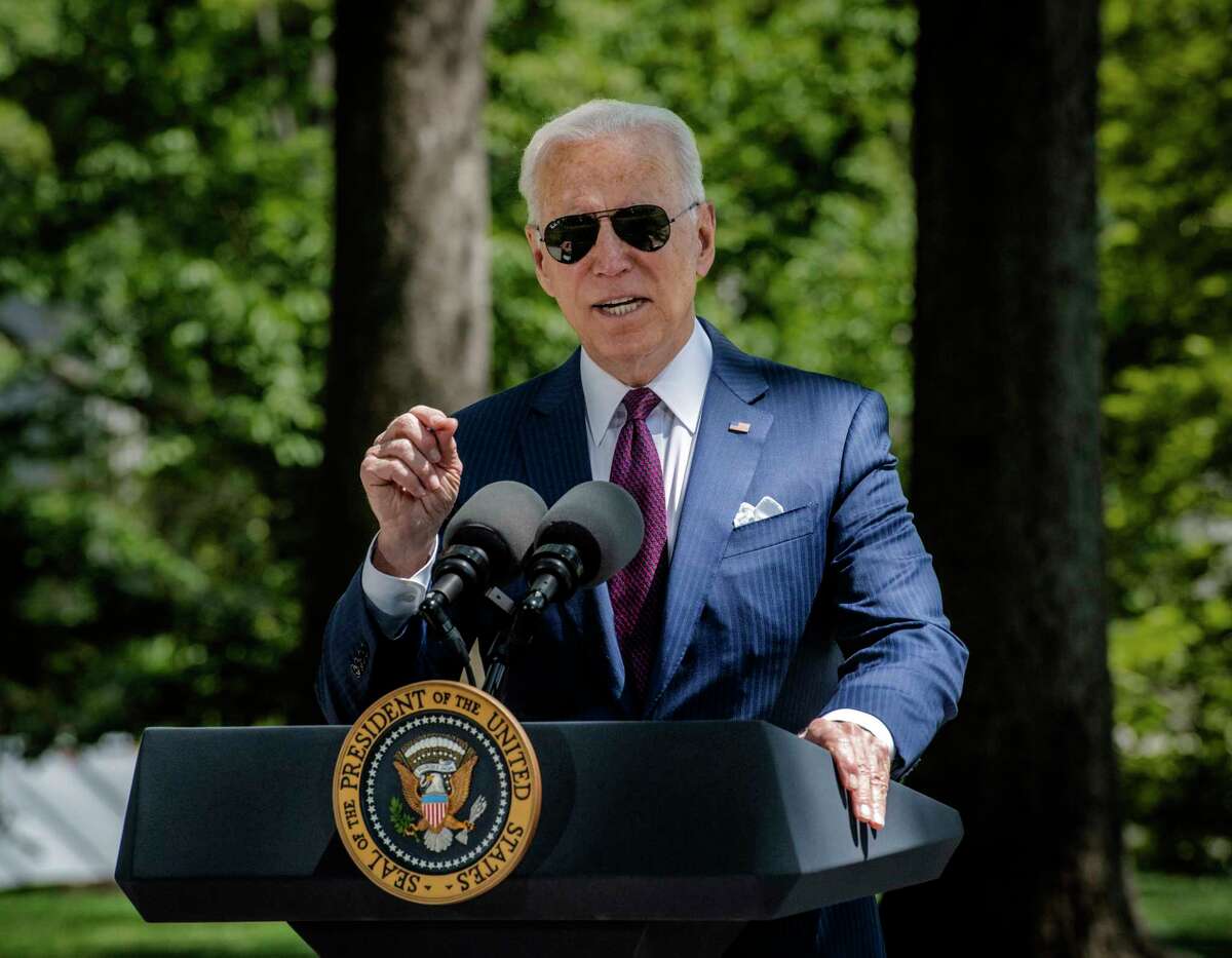 President Biden steps back to the podium after delivering remarks on the White House front lawn on April 27, 2021.