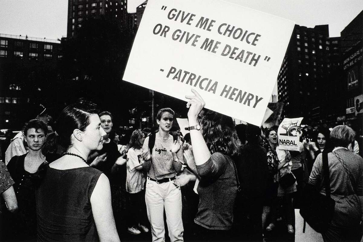 “Choice Aint No Joke, Union Square, N.Y.C.” (1989) by Donna Ferrato is part of “Of Woman Born,” a new exhibit at Housatonic Museum of Art exploring male dominance over women.