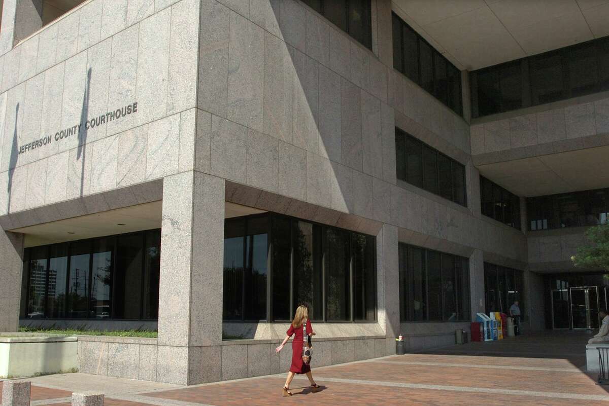 A woman walks by the Jury Impaneling Room at the Jefferson County Courthouse. Pete Churton/The Enterprise