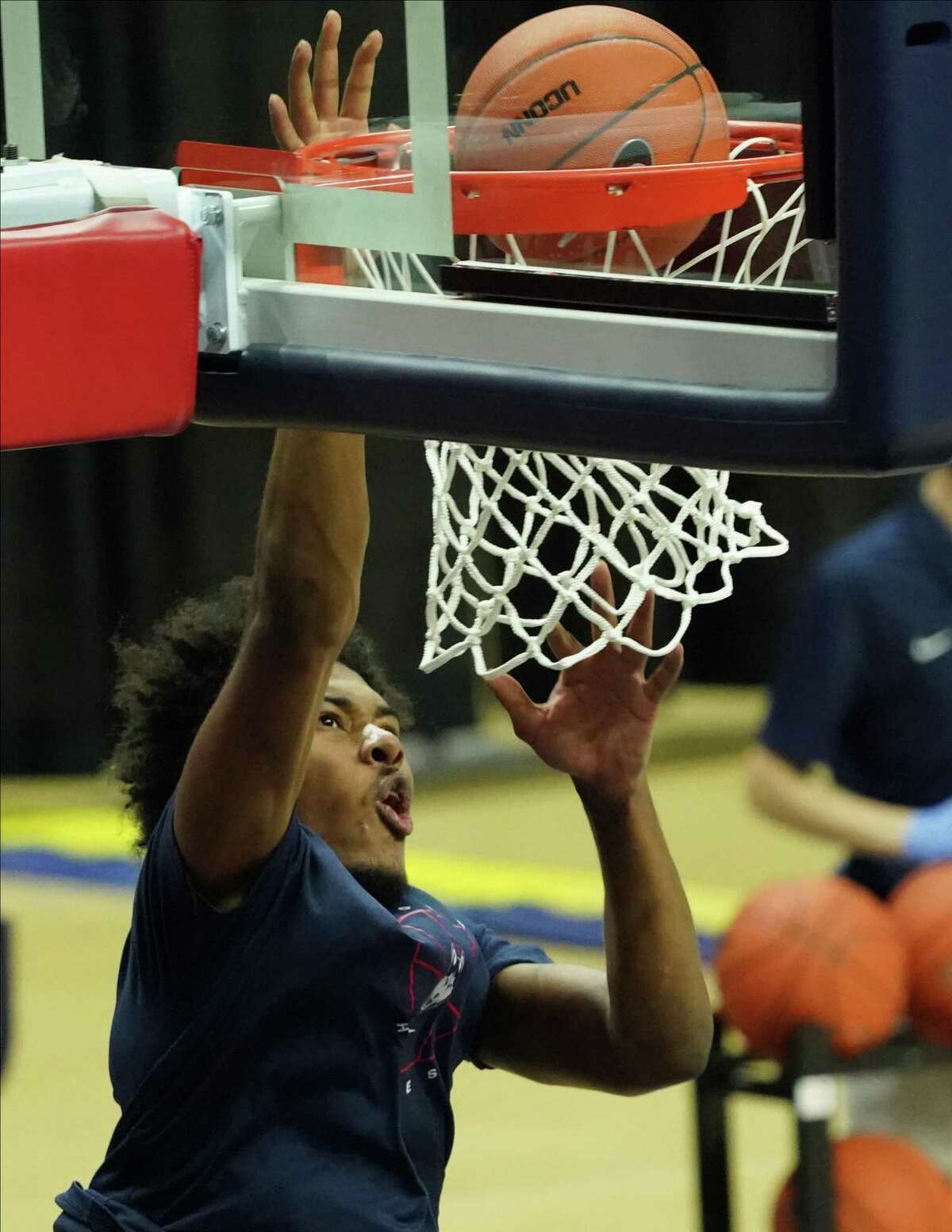 Nov 25, 2020; Storrs, CT, USA; Connecticut Huskies forward Richie Springs (13) warms up before a game against the Central Connecticut State Blue Devils at Gampel Pavilion. Mandatory Credit: David Butler II-USA TODAY Sports
