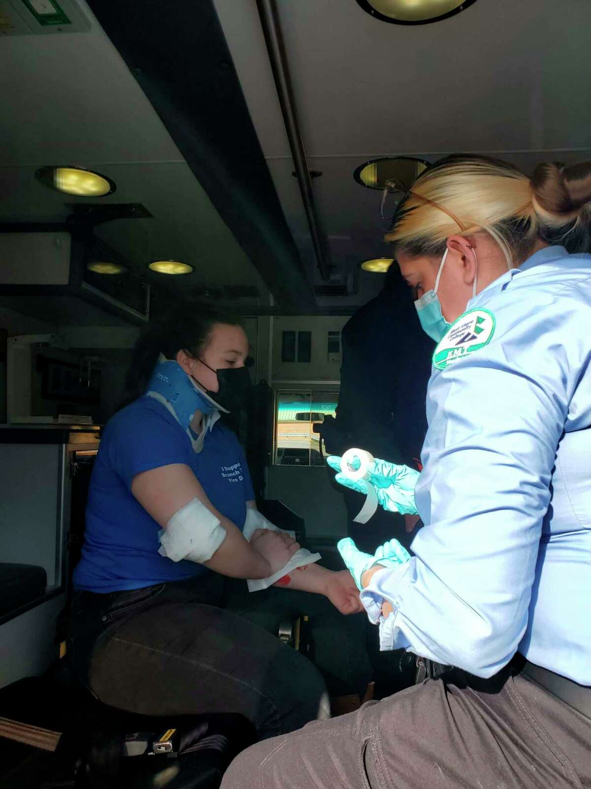 WSCC EMT Student Makenna Robertson gives medical attention to Emily Abbott, CTE Allied Health student from Mason County Central, in the back of the ambulance. (Submitted photo)    