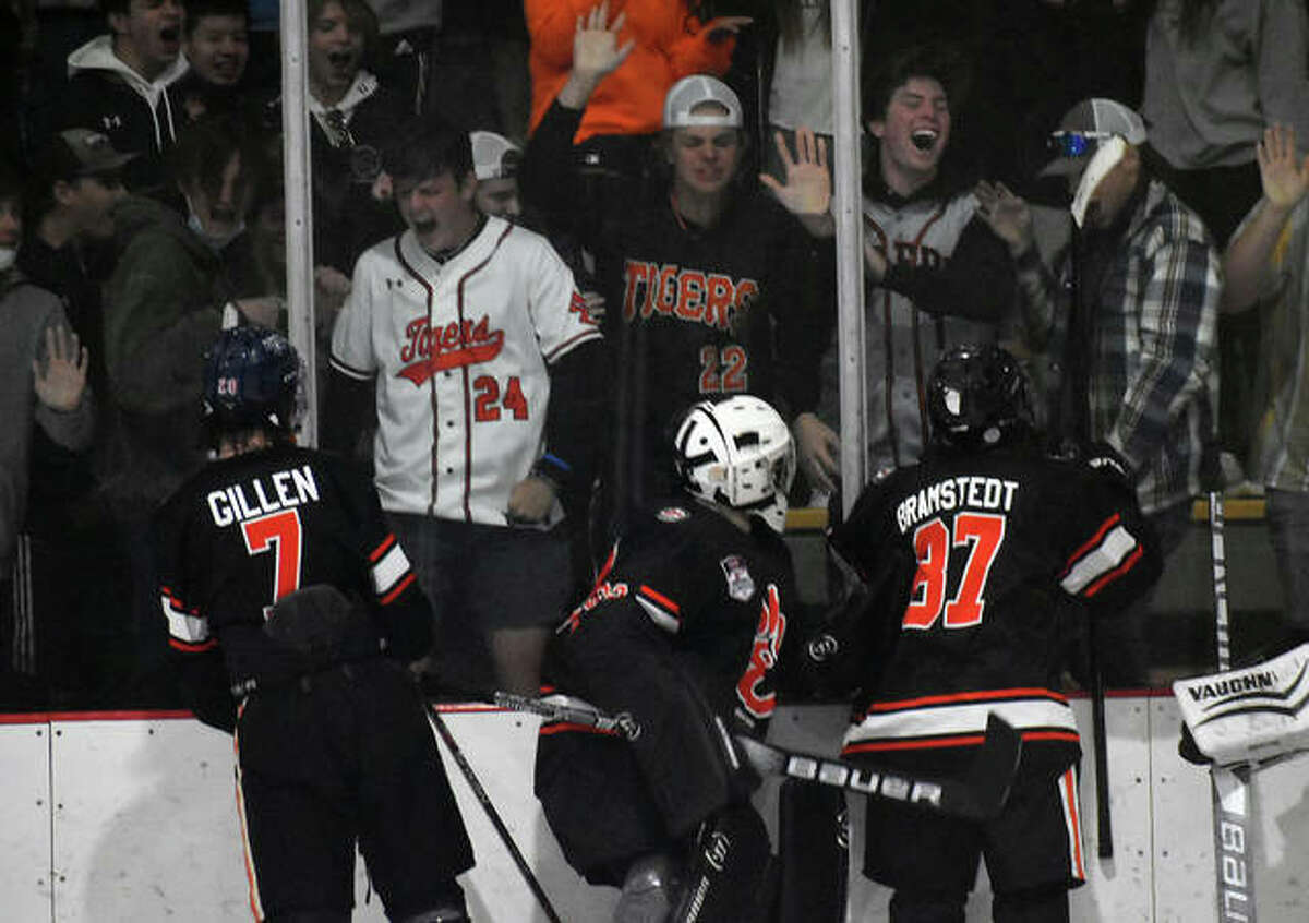 Edwardsville’s Cam Gillen, left, Jonas Akeman, center, and Fred Bramstedt celebrate with the student section after a 2-1 win over Columbia on Wednesday in East Alton.
