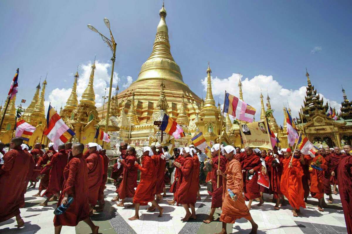 Buddhist monks march down a street in protest in Yangon, despite stern warnings from Myanmar’s junta against anti-government demonstrations.
