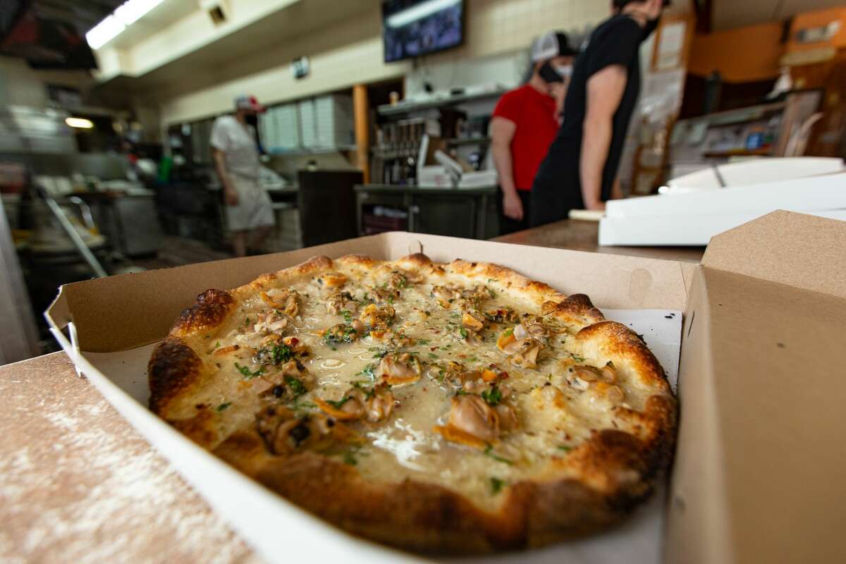 Hot clam pizza being boxed at Zuppardi's in West Haven on April 23, 2021.