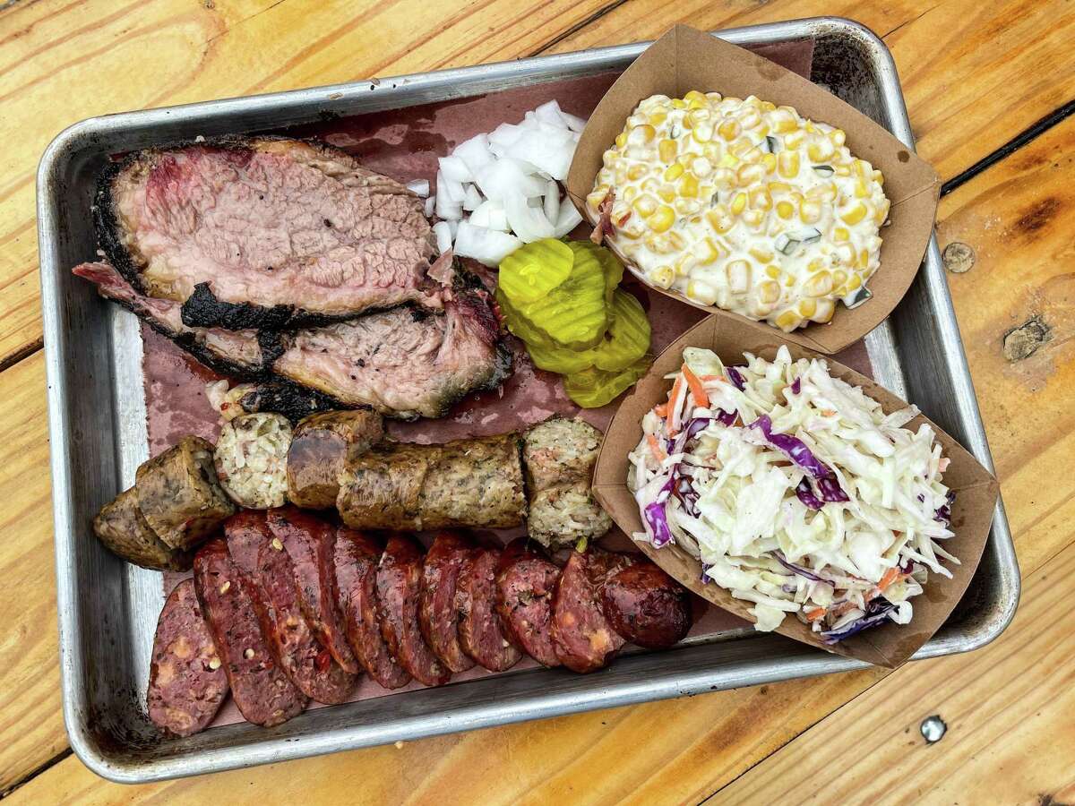 Brisket, smoked boudin and jalapeño & cheddar sausage with cream corn and coleslaw at Henderson & Kane General Store