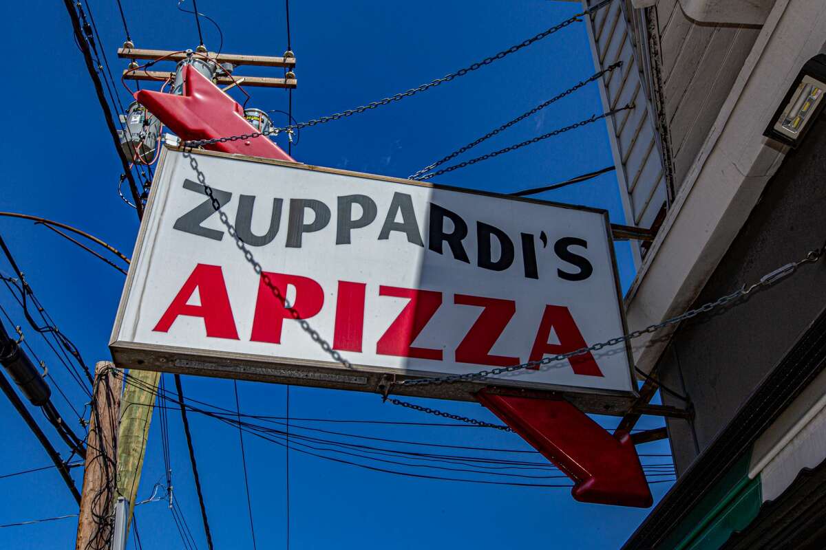 This sign outside Zuppardi's Apizza in West Haven on April 23, 2021.
