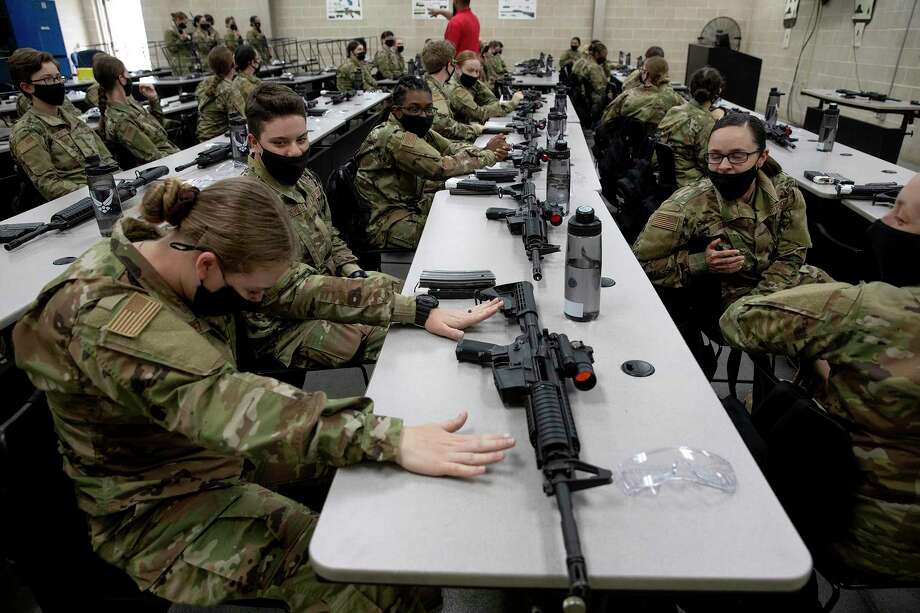 A group of trainees nervously wait for their first chance to fire live rounds during basic training. Photo: Jessica Phelps /Staff Photographer / **MANDATORY CREDIT FOR PHOTOG AND SAN ANTONIO EXPRESS-NEWS/NO SALES/MAGS OUT/TV  © 2021 San Antonio Express-News