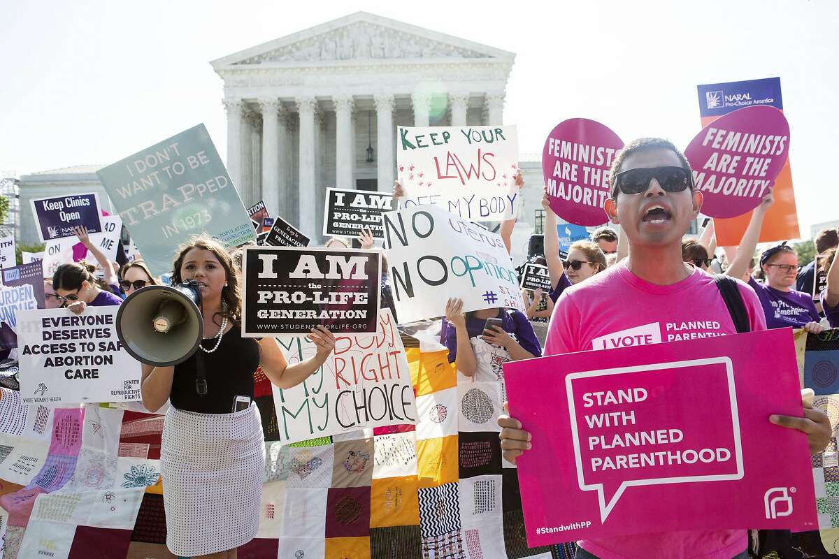 Pro-abortion rights and anti-abortion protesters rally in front of the U.S. Supreme Court in Washington, June 27, 2016. The court is expected to finish its term today with a decision on abortion ñ a case deciding the constitutionality of two provisions of a Texas law regulating abortion could affect access to abortions for millions of women in several states. (Zach Gibson/The New York Times)