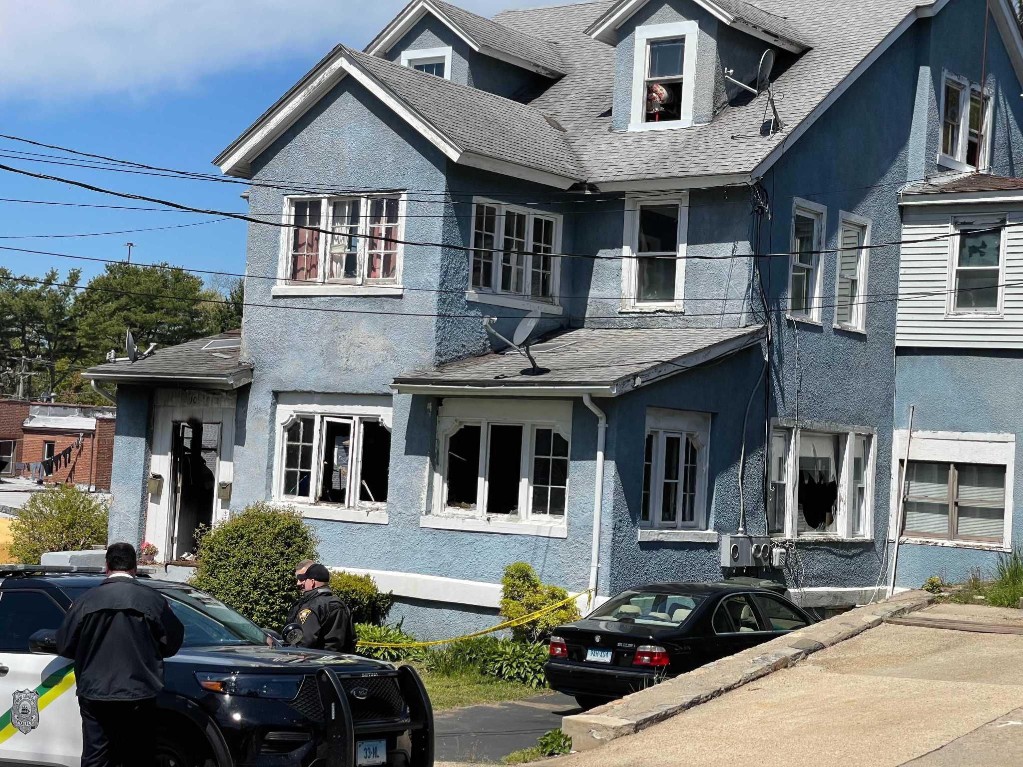 Neighbor heard screams before New London arson; search for father of