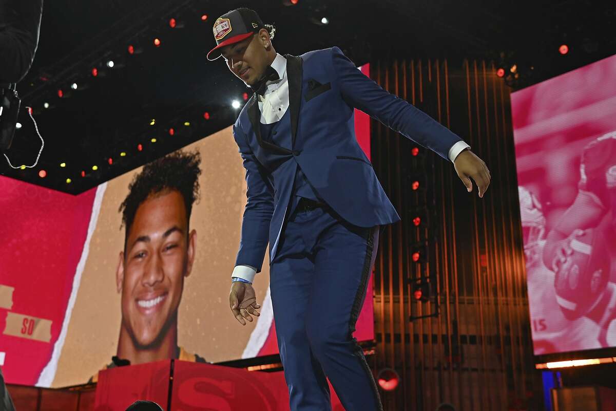 North Dakota State quarterback Trey Lance walks down the runway after he was chosen with the third overall pick by the San Francisco 49ers in the first round of the NFL football draft Thursday April 29, 2021, in Cleveland. (AP Photo/David Dermer)